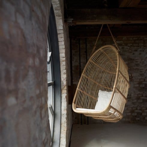 Indoors hanging chair next to window