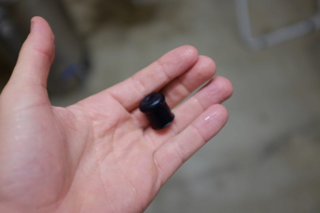 Rubber stopper to prevent grain entering pump