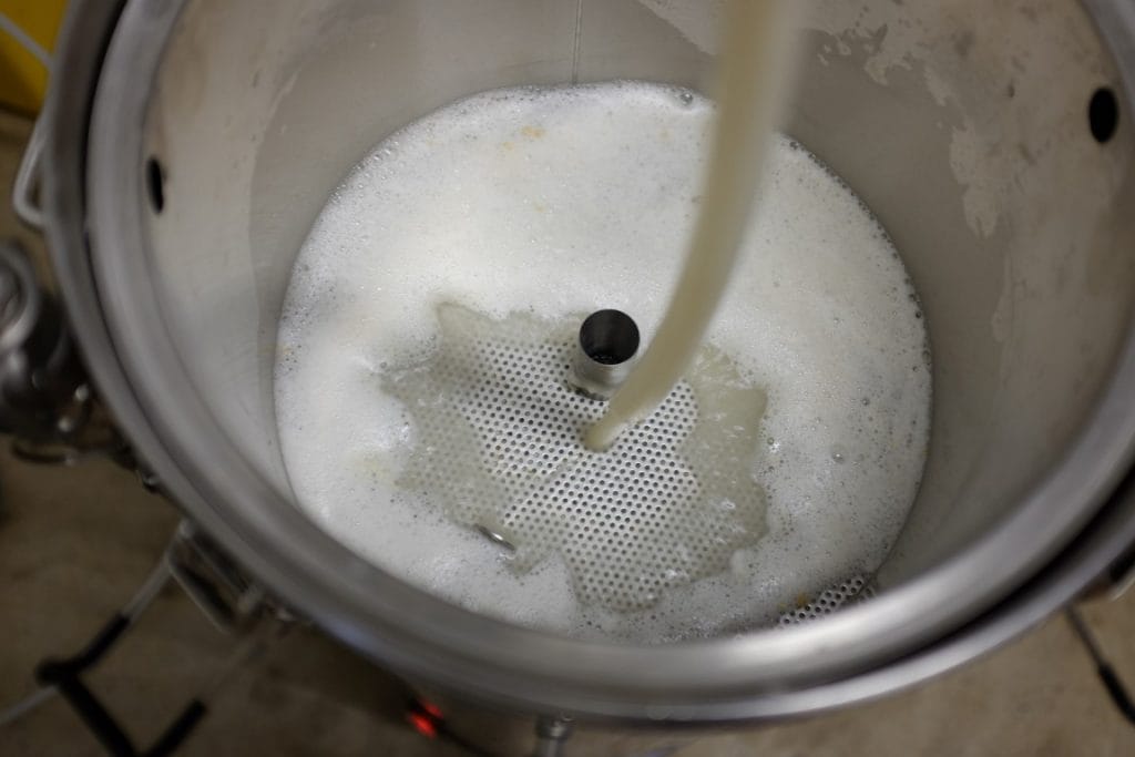Beginning the mash in an all grain brewing system